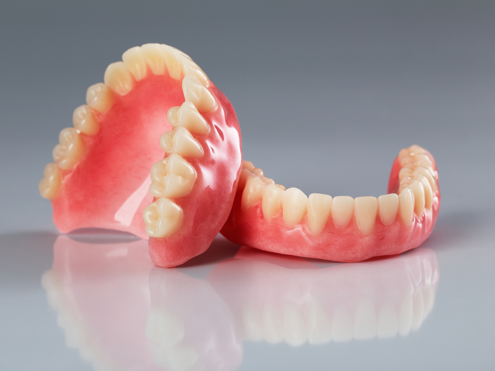 What are the highest quality dentures made of?